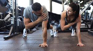Toning Bingo Wings: Your Ultimate Guide to Sculpting Sleek Arms at the Gym 3 Fitness trainer demonstrating arm toning exercises Hampton