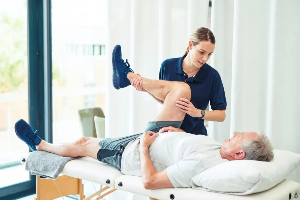 Revitalising Recovery: Effective Rehabilitation Strategies for Muscle Injuries 3 Physiotherapist assisting a patient with muscle recovery exercises Hampton