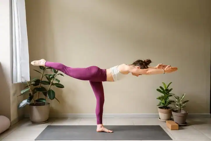 Achieving the Perfect Tone: How Often Should You Exercise for Results? 1 Woman doing Yoga exercise Hampton to help with toning the body.
