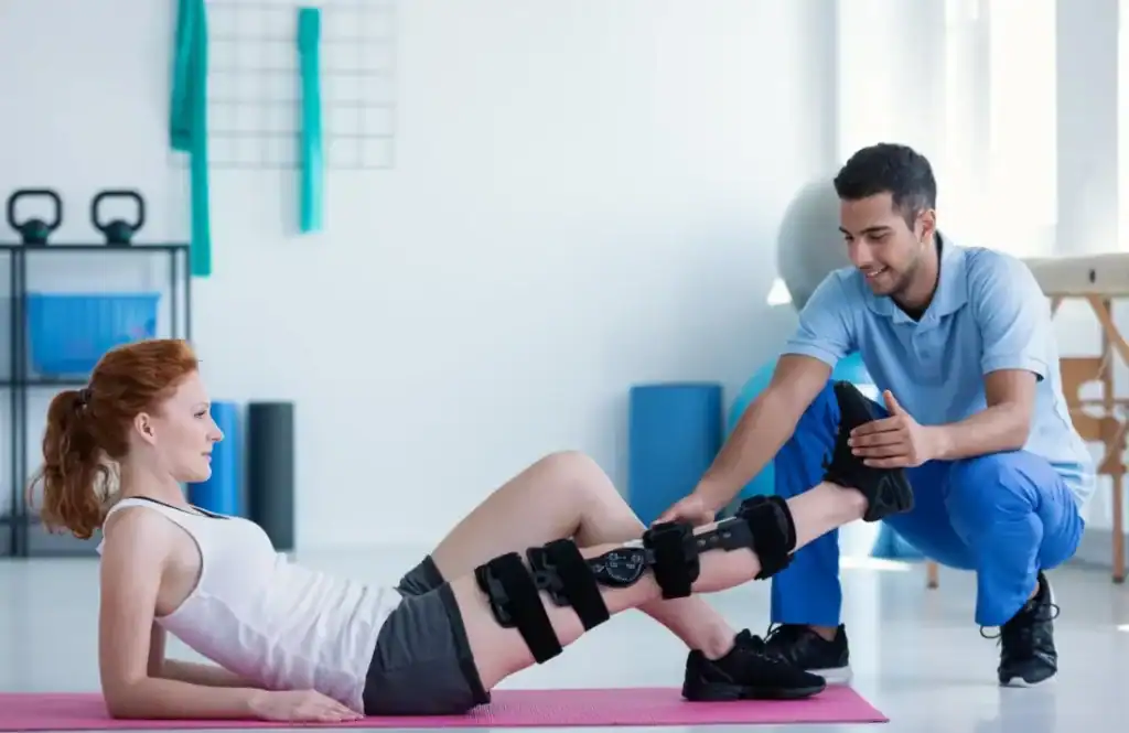 Debunking Meal Timing Myths: The Truth About Muscle Recovery 1 Woman having treatment to help muscle recovery Hampton after an injury